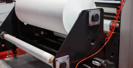 Fabrics roll of hybrid sublimation printer. Printing industry.